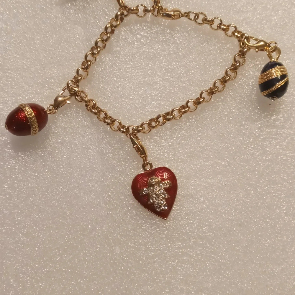Faberge egg charm bracelet on a gold tone rolo chain. - Picture 16 of 16